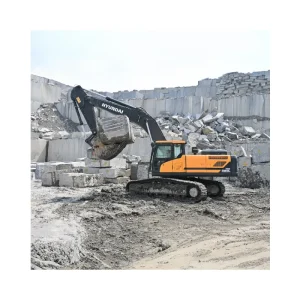 Hyundai HX380L crawler mining excavator working in granite quarry